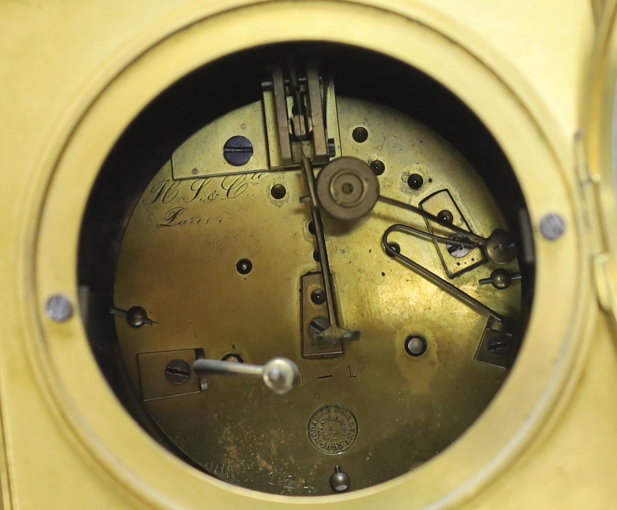 A brass French mantel clock (missing bell and pendulum), 35cm high